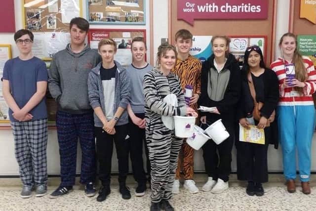 A picture of Team 6 Wave 2 after their bag packing activity.