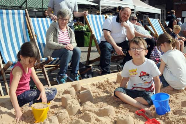 Gainsborough Beach Party.Zoe and Paul Adams go for the record number of sandcastles on the beach on Saturday morning.