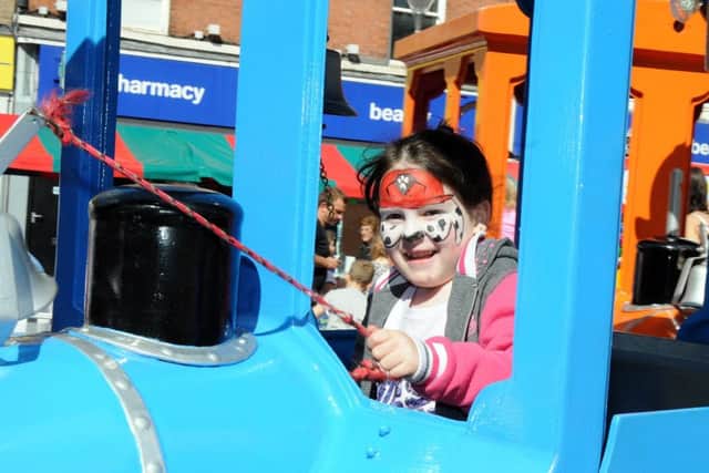 Gainsborough Beach Party.Bethanie Fraser, 6, has a go on one of the fairground rides around the beach.