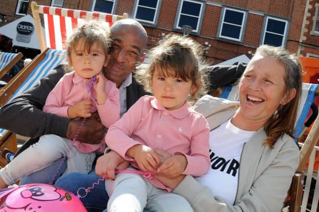 Gainsborough Beach Party.Two year old twins, Ava and Nereah Henry with their grandparents Susan and Lorenzo Henry have a minute on the deck chairs.