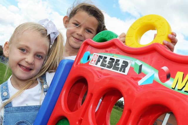 From the Heart fun day.
Angel Edward, 6, and Sophie Speed, 8, have a go at connect four at the fun day held at the Manton Community Centre on Saturday.