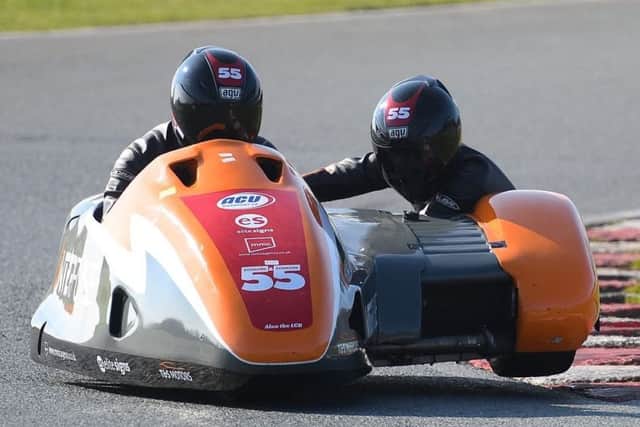 The Team SaS sidecar-racing team, Jen and Giles Stainton, in action at Mallory Park in Leicestershire. (PHOTO BY: Sid Diggins).