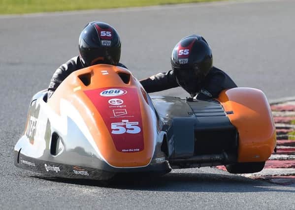 The Team SaS sidecar-racing team, Jen and Giles Stainton, in action at Mallory Park in Leicestershire. (PHOTO BY: Sid Diggins).
