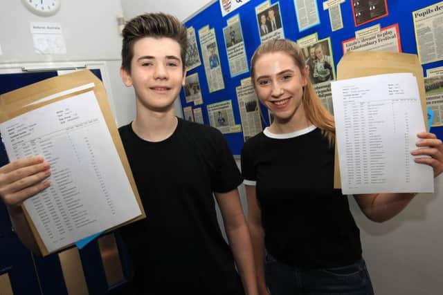 GCSE results day 2017 at Queen Elizabeth's High School in Gainsborough. Pictured are Jack Turgoose and Autumn Usher.