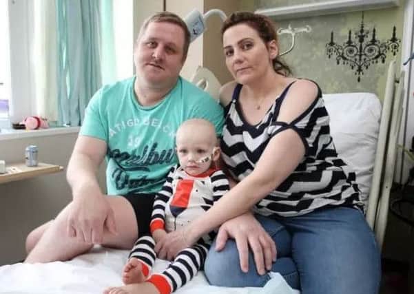 Dawson Willcock in hospital with parents David and Wendy. Photo: Joseph Raynor.