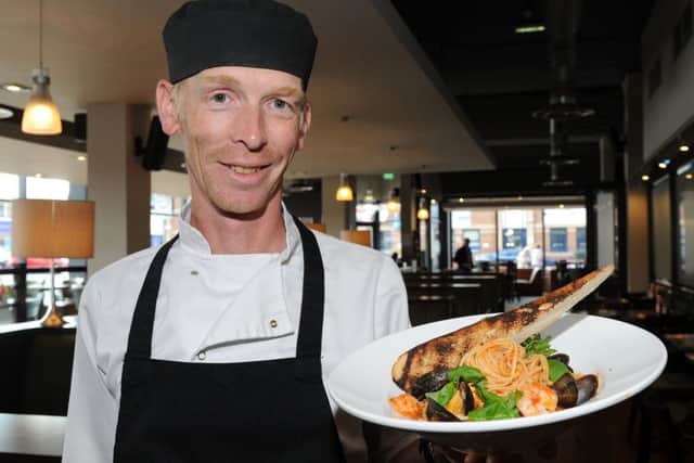 Head chef Nick Hinton at Relish with the seafood linguini dish.