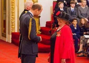 Jackie Scott receiving her MBE