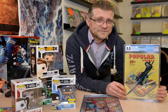 Adam Hall pictured in his new shop on Hardy Street, Comic Quest