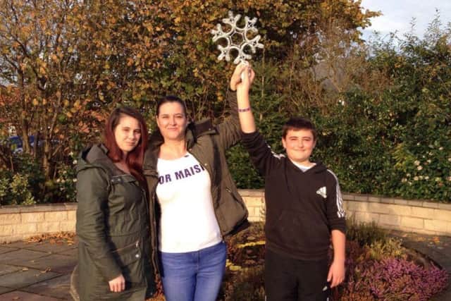 Pictured with the star are (from left) sister Amy, mother Helen Cousin, with brother Oliver Cousin-Stirk