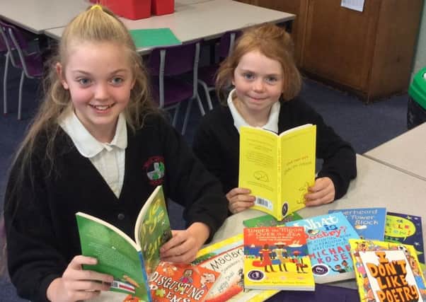 Parish pupils Sophie Beaumont and Teagan Battrawden have won a prize for their school with their poetry