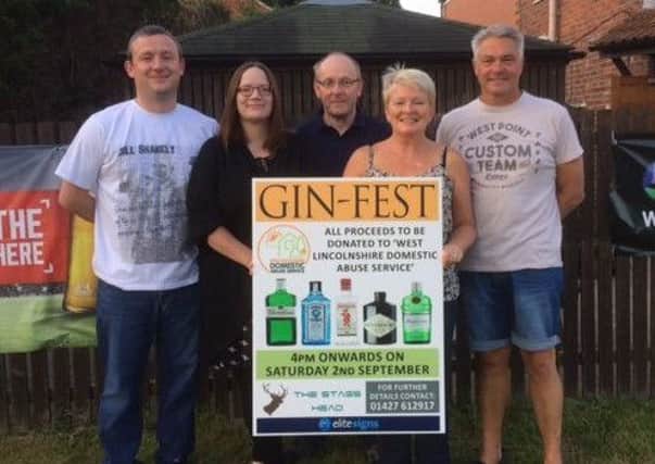 Jo Nuttall (second from right) with husband Mick Nuttall (far right) and fellow organisers, (from left) Andy Coulson, Ella Coulson and Tim Dubois, at the gin-fest.