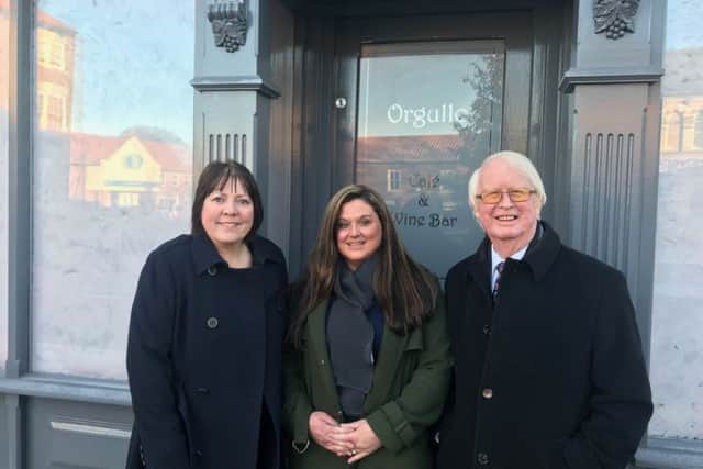 Councillors Julie Reed and John Briggs with Kiera Booth who owns the wine bar with her husband David