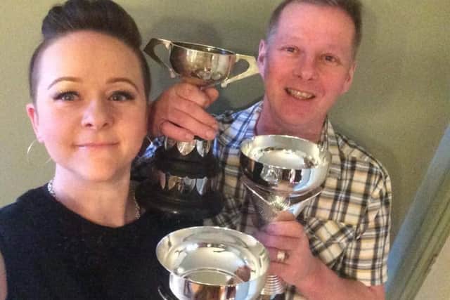 Jubilant Jen and Giles Stainton, of Upton, with the award for their achievements and perseverance in the sport of sidecar-racing.
