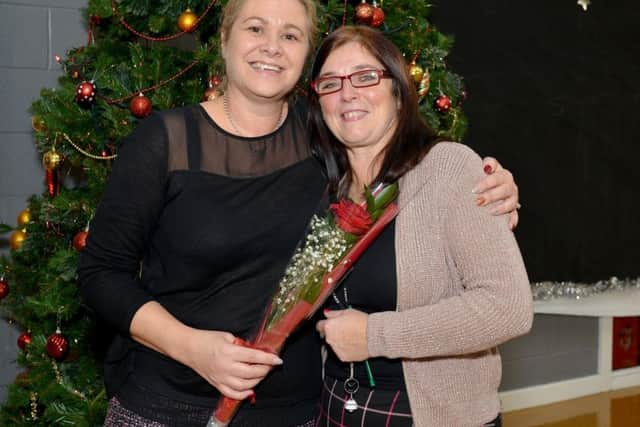 Guardian Rose presentation to Joanne Maddison at Redlands Primary School, Joanne is pictured left recieving her rose from Sonia Batty