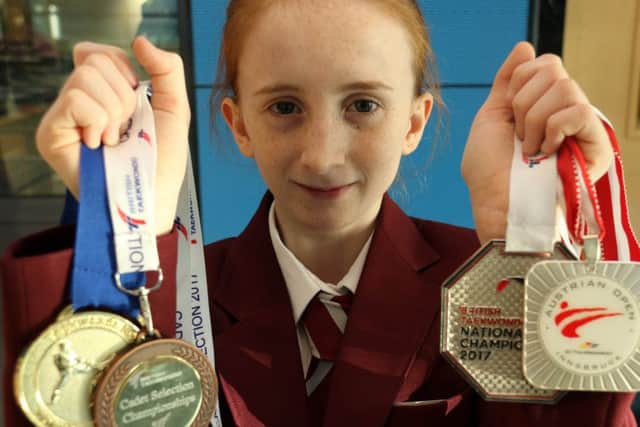 Latisha Garbett with her medals