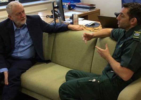 Labour leader Jeremy Corbyn meets paramedic Andy Henderson during his visit to the Lincolnshire headquarters of the East Midlands Ambulance Service.