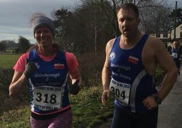 Husband-and-wife duo David and Helen Sweeting crossing the line together at the end of the Ferriby Ten-Mile Race.