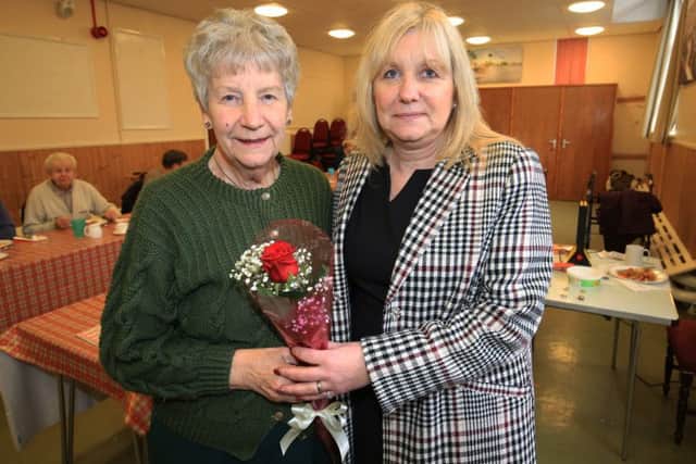 Anne Holmes is presented with The Guardian Rose after being nominated by her daughter Josie Woods for all her work serving diners at Whitwell Community Centre. Anne is pictured with her daughter Josie.