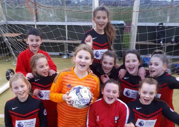 The victorious Parish team who won the first girls football tournament, organised by Gainsborough Trinity, and are now dreaming of the national finals at Wembley.