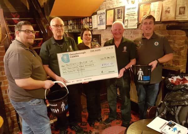 A cheque is presented to Julian Clark on behalf of Prostate Cancer UK by Gainsborough CAMRA (from left) Scott Young, Julian Clark, Helen Warburton, John Platt and Mark Sim.