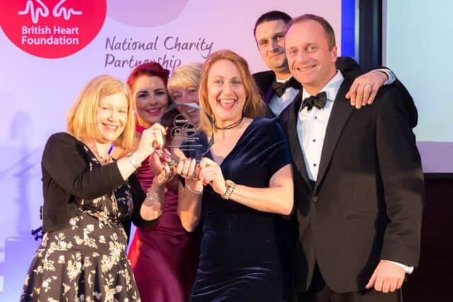 Staff celebrate their fundraising team of the year award.