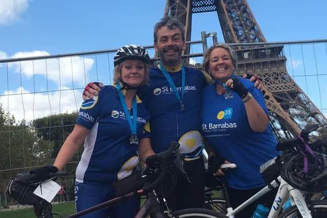 Chris, Caroline and her friend Becca arrive in Paris at the end of a four-day, 300-mile bike-ride.