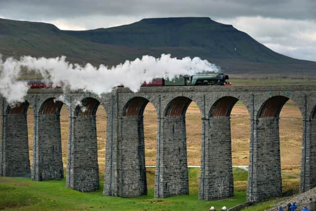 The Flying Scotsman crossing the Ribblehead Viaduct, on its journey from Oxenhope to Carlisle to celebrate the re-opening of the Settle Carlisle Railway line. 31 March 2017. Picture Bruce Rollinson