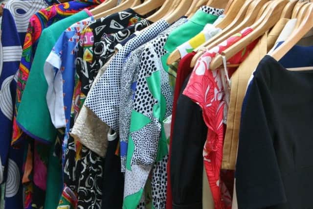 Dresses in cupboard. Photo by Pixabay.