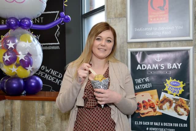 Adam's Bay fish and chip shop launch battered Cadbury Creme Egg, pictured is Jade Hearn.