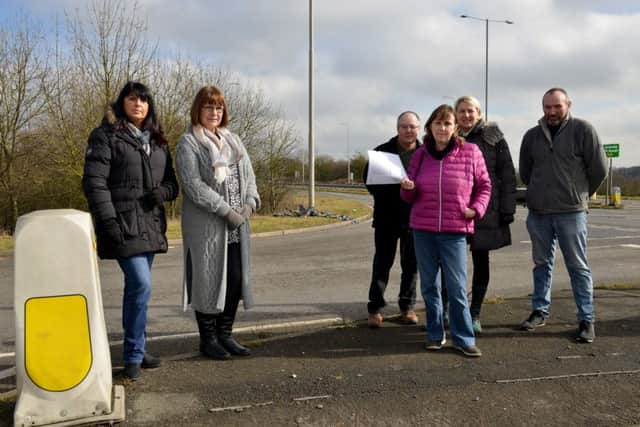 Business are calling for action at an accident blackspot. Pictured is Karen Wilkes with emails from concerned residents, with Dave Fletcher, Paul Mitchell, Evelyn Barnaby and Kristina Marfleet.