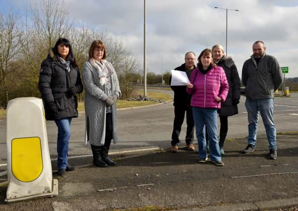 Business are calling for action at an accident blackspot. Pictured is Karen Wilkes with emails from concerned residents, with Dave Fletcher, Paul Mitchell, Evelyn Barnaby and Kristina Marfleet.