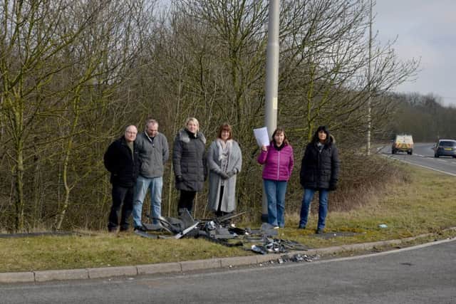 Local business on Corringham Road Industrail Estate are calling for action at an accident blackspot, pictured is Karen Wilkes with emails from concerned residents with Dave Fletcher, Paul Mitchell, Evelyn Barnaby and Kristina Marfleet