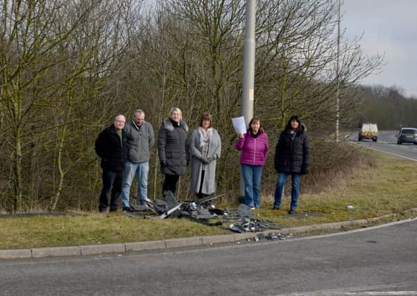 Local business on Corringham Road Industrail Estate are calling for action at an accident blackspot, pictured is Karen Wilkes with emails from concerned residents with Dave Fletcher, Paul Mitchell, Evelyn Barnaby and Kristina Marfleet