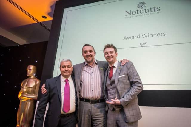 Notcutts Dukeries employee Daniel Jones (right) receives his Frontline Hero award with Notcutts operations director Chris Coward (centre) and centre manager Andrew Rawson (right).