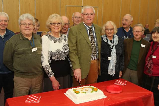 Cardiac Support Group 25th anniversary, current chair Chris Coldwell and founding chair Peter Snell cut the celebration cake watched by members
