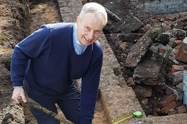 Reverend Jonathan Strickland digging for his dream