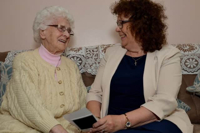 Bassetlaw District Council Chairman Madelaine Richardson reminiscing with her Great Aunt 100 year old Dot Finch