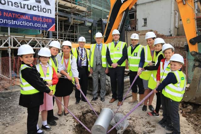 The topping out ceremony of the new Travelodge development in Gainsborough. Pupils from The Gainsborough Parish Church School helped to bury a time capsule.