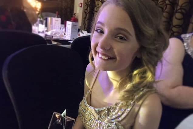 Fundraiser Brooke with her Future Stars award