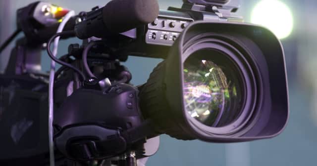 Professional digital video camera. accessories for 4k video cameras. tv camera in a concert hall