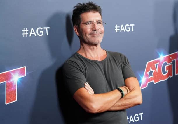 Simon Cowell has broken "parts of his back" following his bike accident (Photo: Rachel Luna/Getty Images)