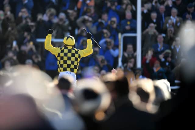 Paul Townend riding Al Boum Photo celebrates winning the Gold Cup in front of spectators at Cheltenham Racecourse on 13 March 2020. (Pic: Getty Images)