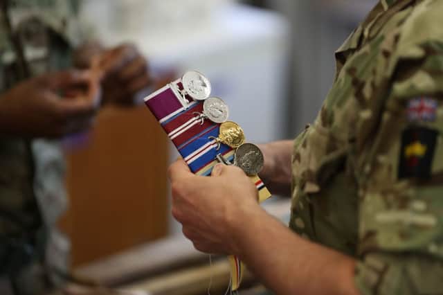 Former military personnel who were discharged from their jobs due to their sexuality are now able to reclaim confiscated medals (Photo: Daniel Leal-Olivas/AFP via Getty Images)