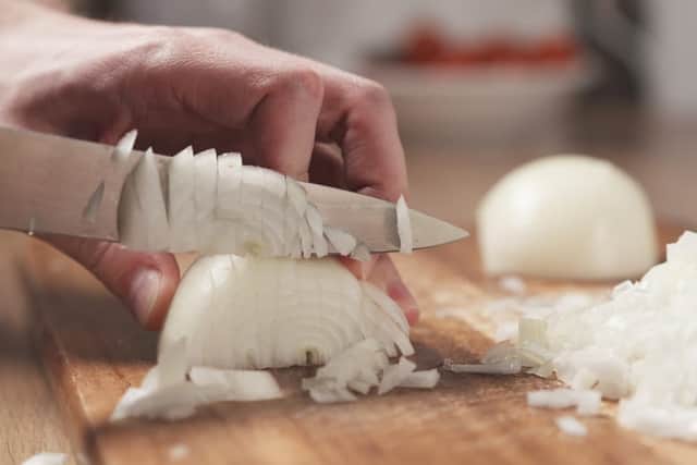 A new hack claims to have found the perfect way to cut onions without causing tears to stream down your face (Photo: Shutterstock)
