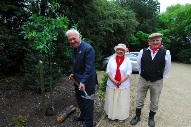 Sherry Forbes, Mike Credland and Lord Lieutenant Toby Dennis carry out the planting of a commemorative oak tree at Martin for the centenary of the WW1 peace celebrations.