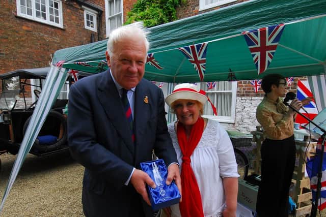 Sherry Forbes presents a cystal glass to Lord Lieutenant of Lincolnshire Toby Dennis thanking him for planting the tree at the centenary event at Martin.