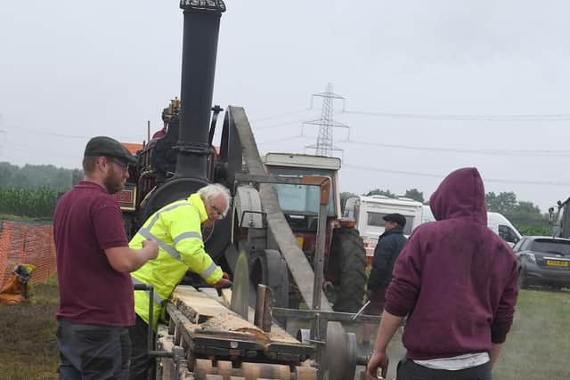 Wood cutting powers by steam traction engine.