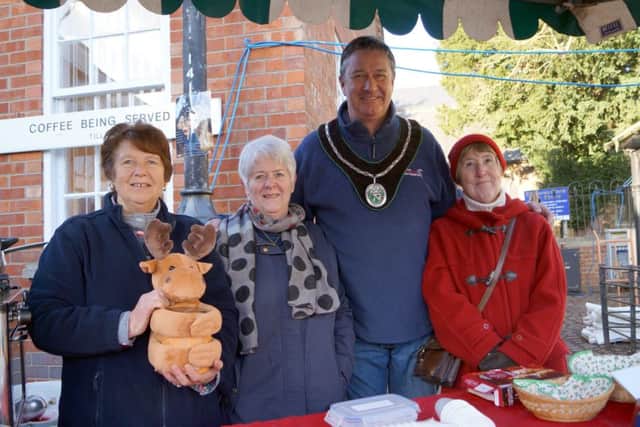 Market Rasen Mayor John Matthews with the ladies on the St Thomas's Church stall EMN-171127-064627001
