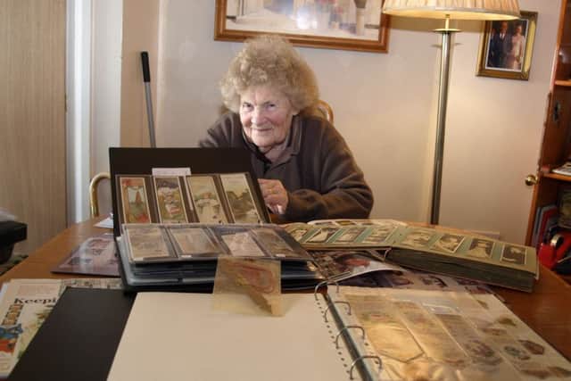 Barbara Smith with just a small hoard of her amazing bookmark collection.