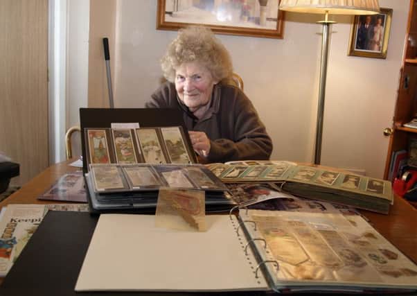 Barbara Smith with just a small hoard of her amazing bookmark collection.